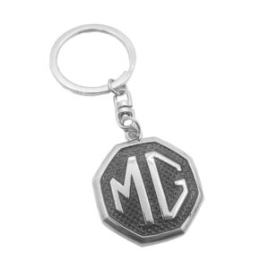 DISEÑO DE COLECCION PARA VEHICULOS MORRIS GARAGES, HECHO DE ALUMINIO CROMADO CON ACABADOS DE LUJO, FONDO NEGRO, LOGO GRABADO.